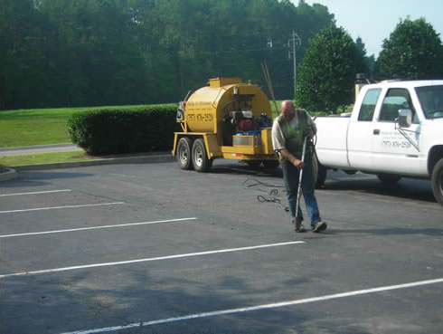 Heavy-duty cracksealing equipment and proper application techniques are key to effective asphalt crack sealing.