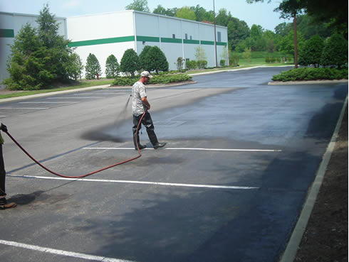 Sealcoating asphalt parking lots extends their useful life and improves appearance